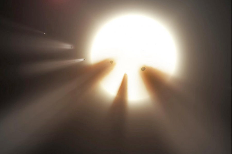 Représentation artistique d'un essaim de fragments de comètes cachant une portion de la lumière d'une étoile. (Crédit: NASA/JPL-Caltech)