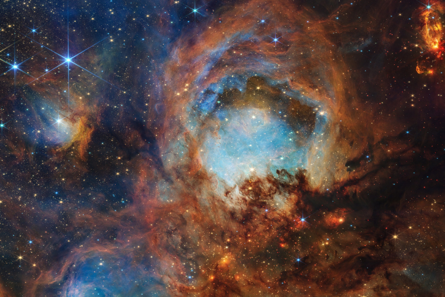 Une partie de la nébuleuse de la Patte de chat, une région locale de formation stellaire composée de gaz, de poussière et de jeunes étoiles. Credit: NASA, ESA, CSA, STScI.